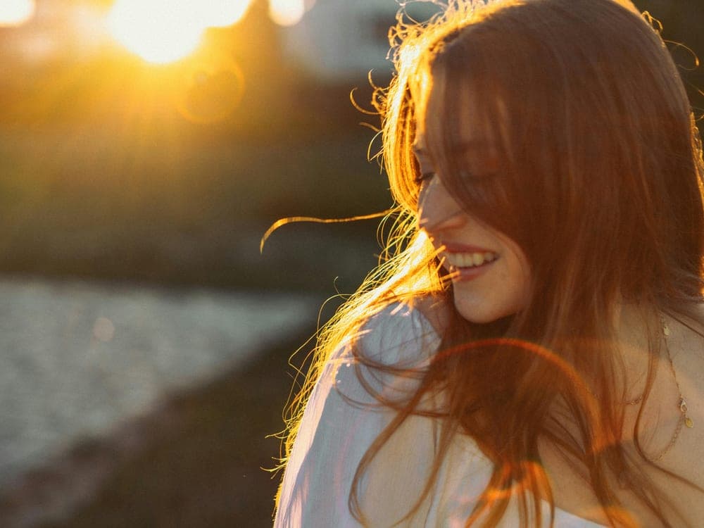 Lila laughing in the golden-hour light
